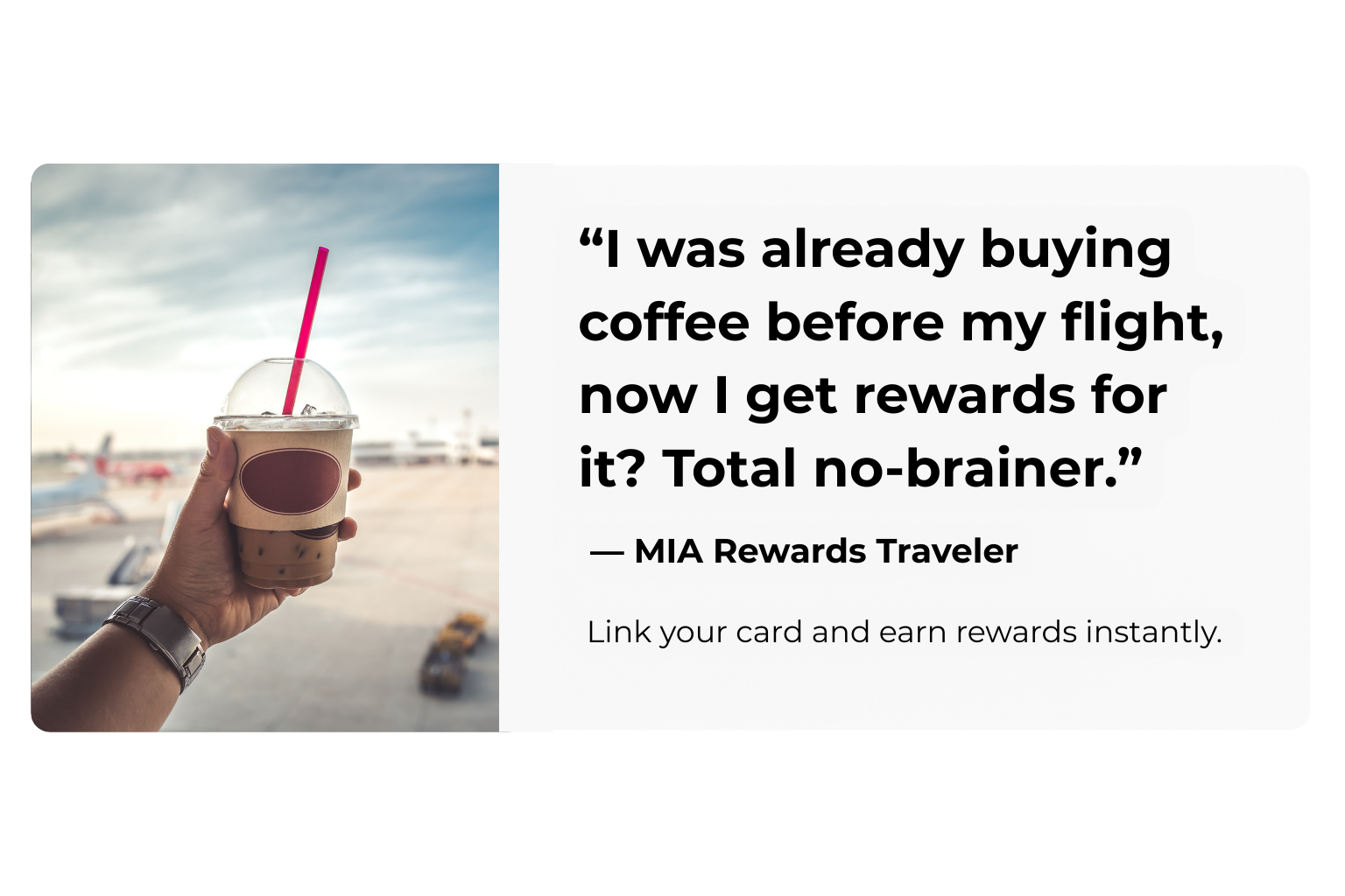 a hand holding a cup with a straw